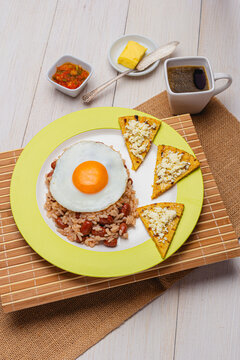 Colombian Calentado Breakfast with Fried Egg, Arepa, Hogao and Tinto Coffee