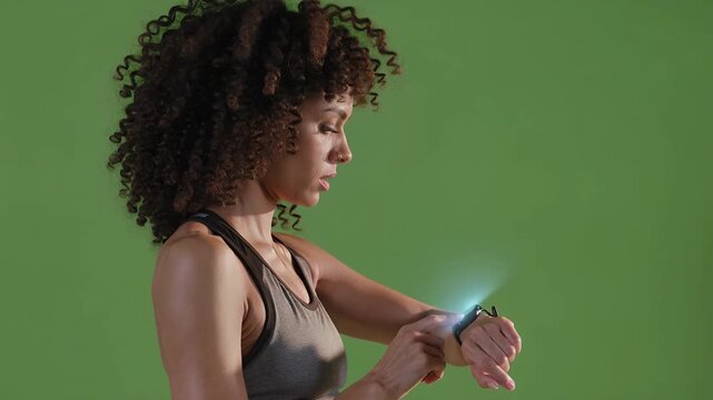 Fitness woman tracking workout on smartwatch green screen mockup