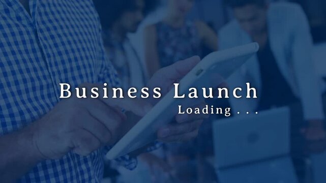 Man tapping tablet, initiating business loading title while camera tightening and coworkers leaning