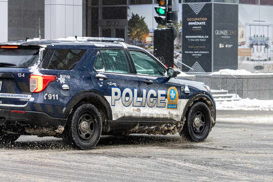 MONTREAL, CANADA, 25 December 2025 : Police SUV in snowy city street scene