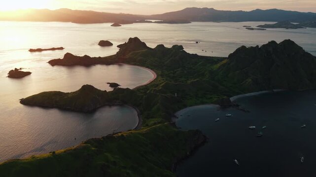 Scenic aerial drone view of Padar Island's iconic tri-colored beaches and lush green hills