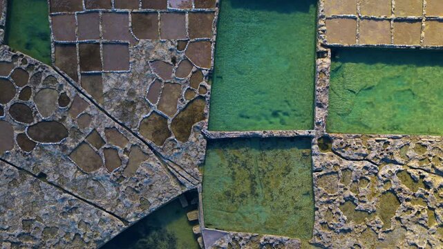 Historic Xwejni Bay Salt Pans On The Island Of Gozo In Malta. Aerial Topdown Shot