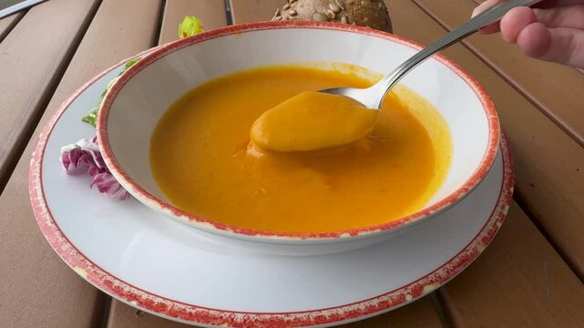 Closeup of Eating a Bowl of Pumpkin Soup