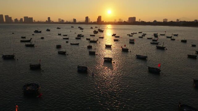 Vietnam, Da Nang Da Nang Golden Hour Fishing Harbor, Warm Sunlight Glinting On Rippled Water Where Numerous Small Boats Float Near Moorings, Highrise Skyline On Horizon And Subtle Maritime