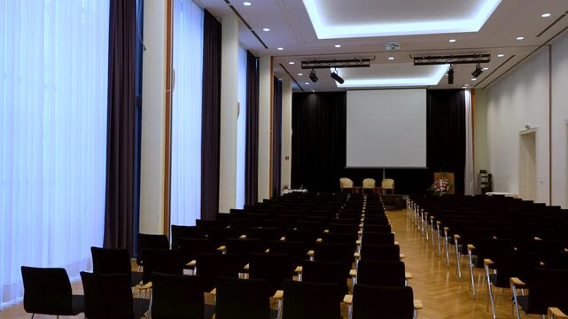 Empty conference room prepared for presentation or lecture, medical seminars and professional gathering place.