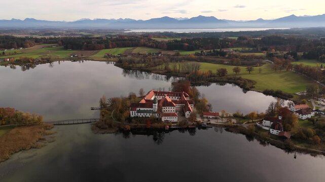 Heritage monastery Kloster Seeon near Chiemsee, an iconic Bavarian landmark in Seeon-Seebruck, Upper Bavaria, Germany. Historisches Kulturdenkmal Kloster Seeon. Drohnenaufnahme. 