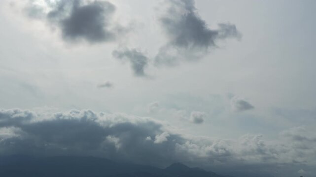 Timelapse of clouds sky are scudding over mountains. Storm warning, climate change, environmental protection. Problem of urban air pollution