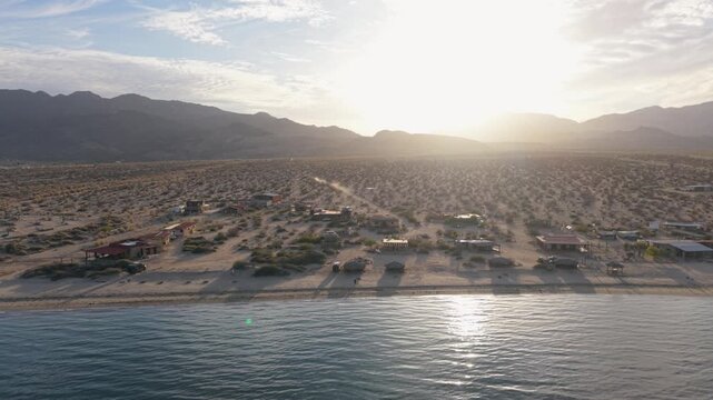 Aerial shots show Bahia de Los Angeles in the late afternoon. The sun sets over the Sea of Cortez and the landscape below.