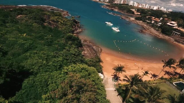 FPV drone cinematic flight over luxury yachts anchored in turquoise water, Espirito Santo