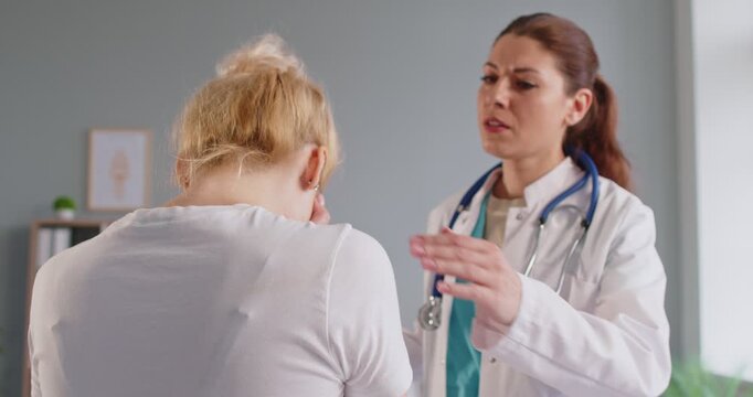 Helping kind doctor supporting during medical consultation, placing reassuring hand on patient shoulder, offering comfort and support, empathetic atmosphere in serious health result discussion caring 