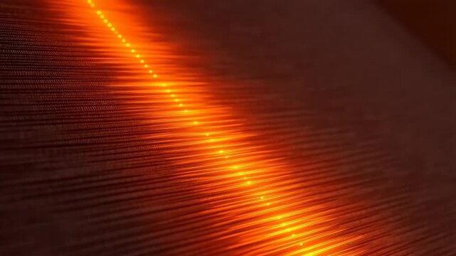 Abstract orange light wave scanning a dark futuristic textured surface