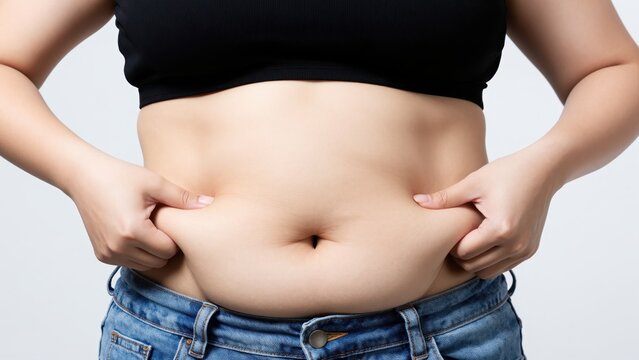 Body Fat Concern: A close-up shot focuses on a person's midriff, showcasing the physical aspect of excess body fat, the image subtly highlights concerns around health and fitness.