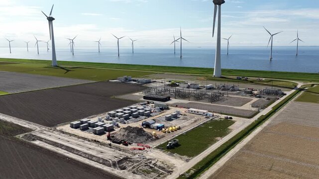 Drone view of large battery energy storage construction for grid balancing, electricity storage, renewable energy, and congestion relief.