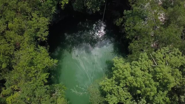 slackline in a cenote in yucatan mexico