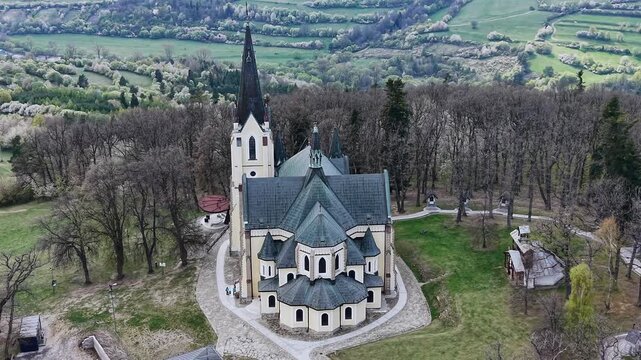 Aerial drone view flying towards the Basilica of the Nativity of the Virgin Mary in Marianka, a historic pilgrimage site in Slovakia