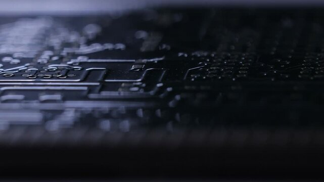 Eletronic circuits board with gold conectors. PCB board macro video with back light.