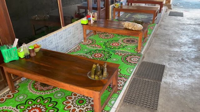 Traditional Indonesian Restaurant Interior with Wooden Dining Tables