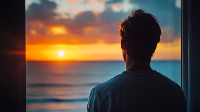 A person looking through a window at the beach during a colorful sunset. generative ai
