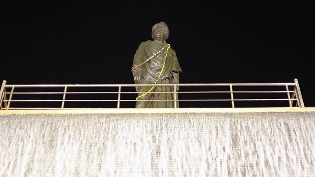 iconic swami vivekananda statue monument with waterfall facade and statue under night lighting