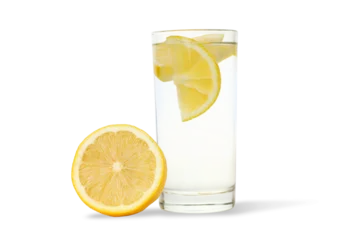Glass of cold lemon drink with lemon slice, PNG © Atlas