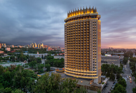 A view of the central part of Almaty, Kazakhstan, with the famous Kazakhstan Hotel at sunset on a spring evening.