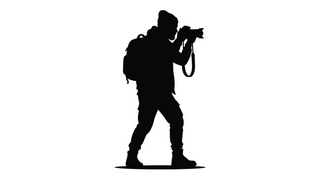Silhouette of a professional photographer wearing a backpack and beanie hat while standing to capture a creative image with a digital camera held up to his eye focused on white background