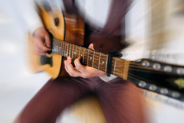 Obraz premium Rock band studio rehearsal. Male musician playing bass guitar before live concert with motion blur effect