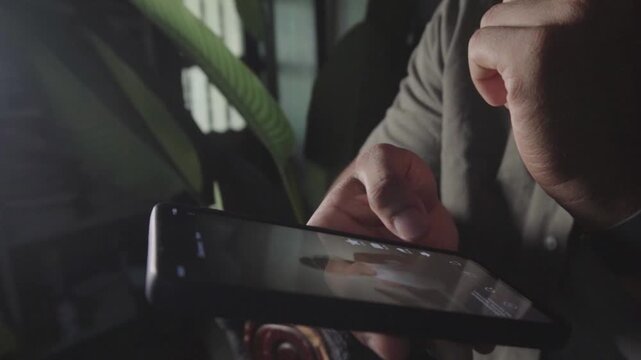 Person scrolling social media feed on smartphone