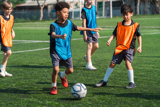 World cup concept with soccer or football player, youth soccer practice children soccer field team sports training ball school outdoor