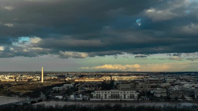 Stunning time-lapse of washington dc cityscape with fast-moving dramatic clouds, showcasing monuments, buildings, and potomac river.