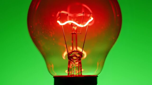Close up of a glowing incandescent light bulb filament 1.