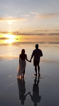 Salar de Uyuni in Bolivia during sunset. Aerial image Rainy Season.Time lapse in vertical video