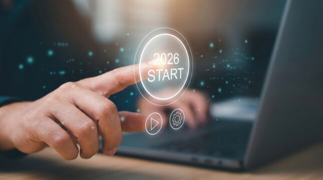 Futuristic Business Launch Concept: Finger Pressing Holographic '2026 START' Button with Glowing UI and Data Particles in Dark Office