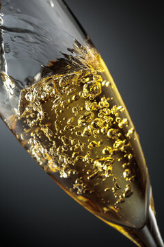 White sparkling wine is poured into a glass.