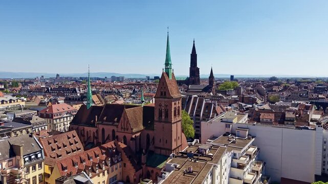 Drone rising above Saint Pierre le Jeune and Strasbourg historic skyline