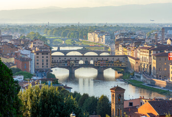 Obraz premium Ponte Vecchio bridge over Arno river at sunset, Florence, Italy