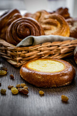 Fototapeta premium Fresh baked bread, various delicious freshly baked bread on white background, copy space. Variety of artisan bread composition, top view