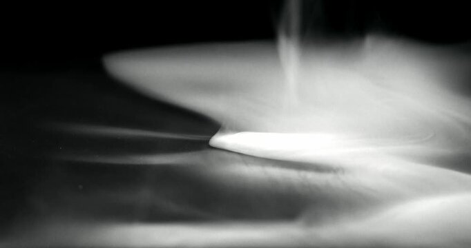 White water vapor drifting and flowing effect against a black background