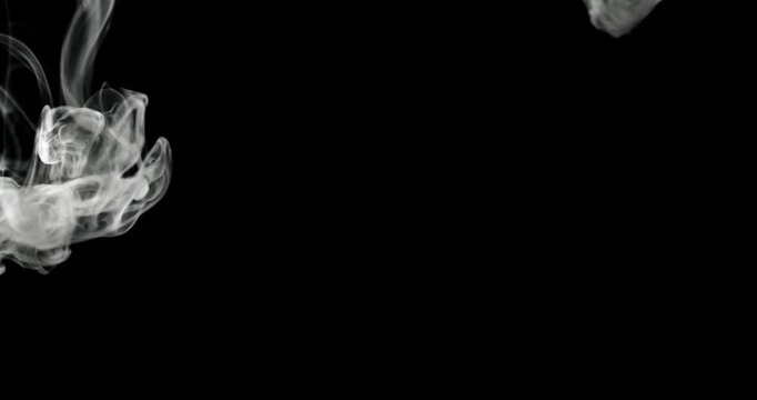 White water vapor drifting and flowing effect against a black background