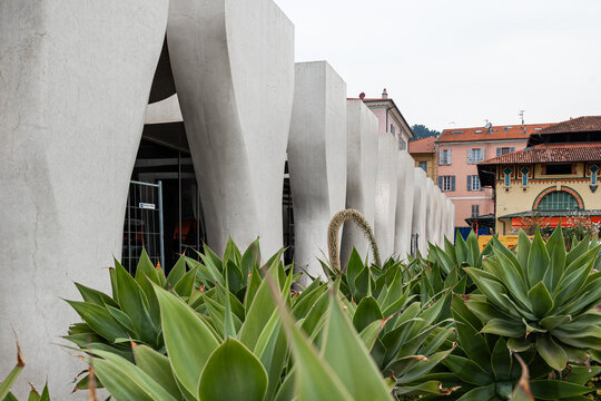 Menton, France, 12 April 2026 the Jean Cocteau Museum in Menton, France, featuring striking white organic concrete pillars against dark glass under a grey sky