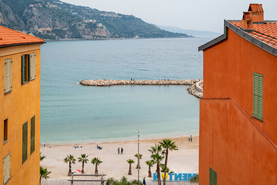 high angle view of sandy shoreline and turquoise waters of Plage des Sablettes in Menton, France