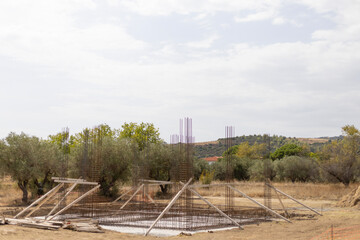 Fototapeta premium Building Foundation Under Construction with Rebar Steel and Wooden Supports
