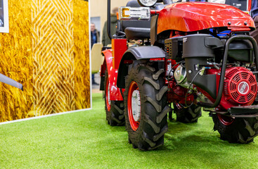 Obraz premium Close-up of a tractor engine. Modern engine in a walk-behind tractor. Agricultural technology.