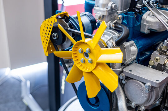Close-up shot of engine fan. Diesel engine motor of tractor or combine harvester in industrial factory close up.