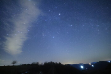 Fototapeta premium Constellations, zodiacal light and Milky Way stars on a dark countryside skies.