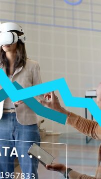 Vertical video: Woman wearing VR visor using data panel appearing man pointing tablet for demo