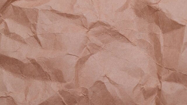 Stop motion of crumpled craft brown paper texture, abstract loop background