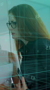 Vertical video: Peer giving docs urging specs woman leaning in reviewing, teal grid overlaying tech