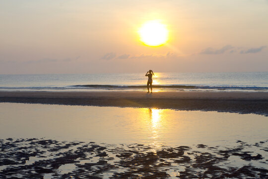 Sunrise and silhouette traveler