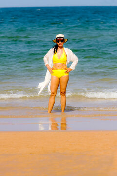 Woman with yellow bikini relax on beach